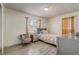 Bright bedroom featuring wood-look flooring and natural light at 4201 Chantelle Rd, Orlando, FL 32808