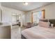 Comfortable bedroom featuring mirrored closet doors and natural light at 4201 Chantelle Rd, Orlando, FL 32808