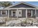 Charming home featuring an eye-catching facade, bright shutters and trim, and inviting front yard space at 4201 Chantelle Rd, Orlando, FL 32808