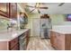 Functional kitchen with stainless steel appliances, light countertops, and wood-look flooring at 4201 Chantelle Rd, Orlando, FL 32808