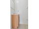 Simple bathroom vanity with a wood cabinet and mirror over a tile floor at 445 Cottonwood Dr, Altamonte Springs, FL 32714