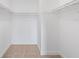 Walk-in closet with shelving, carpet, and ample storage for organizing clothes and personal items at 445 Cottonwood Dr, Altamonte Springs, FL 32714