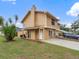 Charming two-story home featuring a manicured lawn and a cozy front porch in a quiet neighborhood at 445 Cottonwood Dr, Altamonte Springs, FL 32714