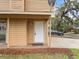 Close up of the front door, a white door with a lock and door bell at 445 Cottonwood Dr, Altamonte Springs, FL 32714