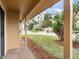 Cozy porch view showcasing the neat front yard, perfect for relaxing and enjoying the outdoors at 445 Cottonwood Dr, Altamonte Springs, FL 32714