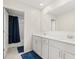 Bright bathroom with double vanity and access to a separate toilet and shower area at 4459 Bluff Oak Loop, Kissimmee, FL 34746