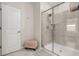 Bright and clean bathroom featuring a glass-enclosed shower, a door to the outside, and stylish details at 4459 Bluff Oak Loop, Kissimmee, FL 34746