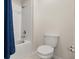 A clean bathroom with a tiled shower/tub combination and a modern toilet at 4459 Bluff Oak Loop, Kissimmee, FL 34746