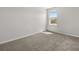 Bright, carpeted bedroom with a window providing natural light; freshly painted and move-in ready at 4459 Bluff Oak Loop, Kissimmee, FL 34746