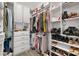 Organized walk-in closet with built-in shelving, drawers, and ample storage for clothes and accessories at 4459 Bluff Oak Loop, Kissimmee, FL 34746