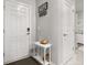 Inviting entryway with a charming accent table and decorative wall hooks at 4459 Bluff Oak Loop, Kissimmee, FL 34746