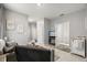 Comfortable living area with access to other rooms, featuring neutral tones and a TV at 4459 Bluff Oak Loop, Kissimmee, FL 34746