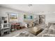 Inviting living room featuring a large sectional sofa, media center and a cozy atmosphere at 4459 Bluff Oak Loop, Kissimmee, FL 34746