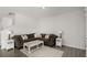 Comfortable living room with a sectional sofa, side tables with lamps, and a decorative rug at 4459 Bluff Oak Loop, Kissimmee, FL 34746
