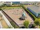 Aerial view of community playground in a fenced in area at 4459 Bluff Oak Loop, Kissimmee, FL 34746
