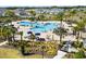 Resort-style community pool featuring tropical landscaping, lounge areas, and a Gathering-friendly swimming space at 4459 Bluff Oak Loop, Kissimmee, FL 34746