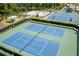 Aerial view of tennis courts and other recreational amenities at 4459 Bluff Oak Loop, Kissimmee, FL 34746