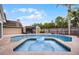 Beautiful backyard pool and spa featuring seating, a shed, and a lush, green landscape at 479 Cidermill Place, Lake Mary, FL 32746