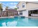 Inviting backyard pool and spa with the exterior of the house and a view of the backyard fence at 479 Cidermill Place, Lake Mary, FL 32746