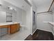 Bathroom featuring vanity, toilet, shower-tub combo, and a large walk-in closet with dark wood floors at 479 Cidermill Place, Lake Mary, FL 32746