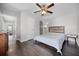 This bedroom features a ceiling fan and wood-look flooring at 479 Cidermill Place, Lake Mary, FL 32746