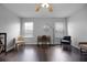 Bedroom with hardwood flooring, ceiling fan, two windows, and contemporary style furniture at 479 Cidermill Place, Lake Mary, FL 32746