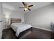 This bedroom features a ceiling fan and wood-look flooring at 479 Cidermill Place, Lake Mary, FL 32746