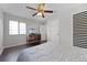 This bedroom features a ceiling fan and wood-look flooring at 479 Cidermill Place, Lake Mary, FL 32746