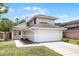 Two-story home featuring a two-car garage, walkway and partial lawn at 479 Cidermill Place, Lake Mary, FL 32746