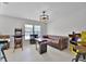 Spacious game room area with arcade games, neutral paint, and leather sofa at 479 Cidermill Place, Lake Mary, FL 32746