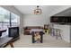 Finished basement area with arcade games, kitchenette, and retro-style seating at 479 Cidermill Place, Lake Mary, FL 32746