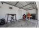 Garage with work tables, tool storage, and coated floor at 479 Cidermill Place, Lake Mary, FL 32746