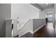 Hallway featuring wood-look flooring and pendant lighting at 479 Cidermill Place, Lake Mary, FL 32746