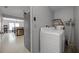 Functional laundry room with washer, dryer, and easy access to the rest of the house at 479 Cidermill Place, Lake Mary, FL 32746