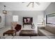 Spacious living room with neutral colors, a large window, and stylish decor at 479 Cidermill Place, Lake Mary, FL 32746