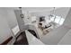 View from upstairs looking down into the living room with a soaring ceiling and modern decor at 479 Cidermill Place, Lake Mary, FL 32746