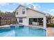 Backyard features a swimming pool and jacuzzi, surrounded by a well-maintained lawn and a patio area at 479 Cidermill Place, Lake Mary, FL 32746