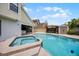 Backyard pool and jacuzzi for outdoor enjoyment and relaxation, accompanied by patio furniture and lush greenery at 479 Cidermill Place, Lake Mary, FL 32746