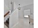 Bright staircase with modern lighting fixtures and a comfortable seating area nearby at 479 Cidermill Place, Lake Mary, FL 32746