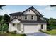 Charming two-story home with a neutral color palette, a two-car garage and beautifully manicured landscaping at 4891 Lyric Dr, Mascotte, FL 34753