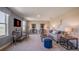 Spacious living area with stylish seating, television, bar, and abundant natural light at 4891 Lyric Dr, Mascotte, FL 34753