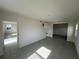 Bright living room featuring tile floors, neutral walls, and ample natural light from the windows at 4891 Lyric Dr, Mascotte, FL 34753