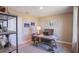 This home office features carpeted floors, a desk, and nautical-themed decorations at 4891 Lyric Dr, Mascotte, FL 34753