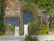 Aerial view of a new home showing the sodded lawn and dark roof at 714 Palmetto Ave, Orange City, FL 32763