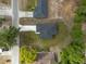 This is an aerial view of a new home with dark roof and driveway at 714 Palmetto Ave, Orange City, FL 32763