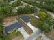 Aerial view shows this home with a long driveway and newly installed sod at 714 Palmetto Ave, Orange City, FL 32763