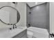 Modern bathroom featuring a stylish vanity, sleek fixtures, and a tiled shower/tub combination at 714 Palmetto Ave, Orange City, FL 32763