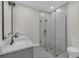 Bathroom features a double vanity with matte black hardware and an elegant glass enclosed shower at 714 Palmetto Ave, Orange City, FL 32763