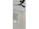 Bedroom with ceiling fan and window letting in natural light at 714 Palmetto Ave, Orange City, FL 32763