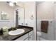 Bathroom with a framed mirror, white tiling, and stylish fixtures at 715 Roughbeard Rd, Winter Park, FL 32792